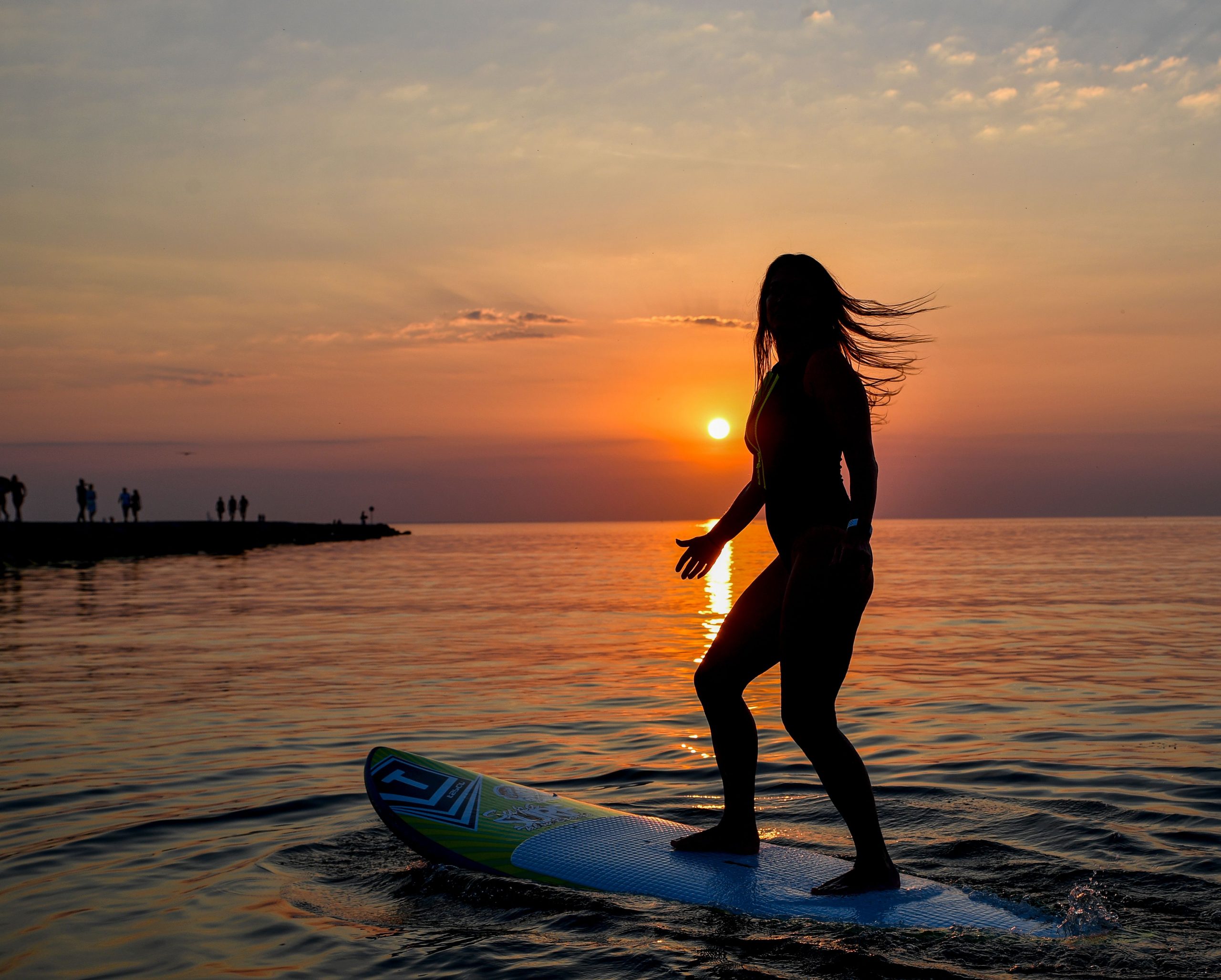 Enjoy serene sunset paddleboarding in Tallinn Bay, Estonia, with breathtaking views.